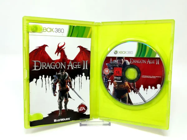 Interior del juego Dragon Age II (ESP) para XBOX 360 con disco y manual