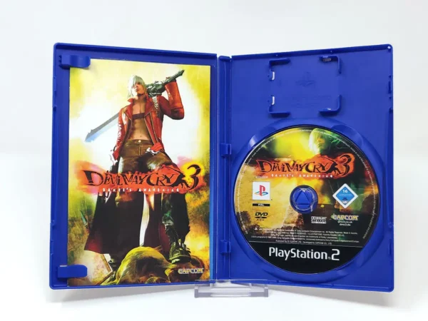 Interior del juego Devil May Cry 3: Dante's Awakening (ESP) para PlayStation 2 con disco y manual