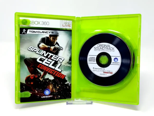 Interior del juego Tom Clancy's Splinter Cell: Conviction (ESP) (Classics) para XBOX 360 con disco y manual