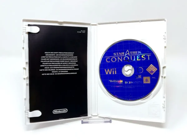 Interior del juego Star Trek: Conquest (ESP) para Nintendo Wii con disco y manual