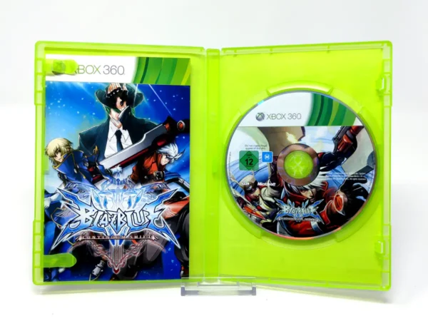 Interior del juego BlazBlue: Continuum Shift (ESP) para XBOX 360 con disco y manual