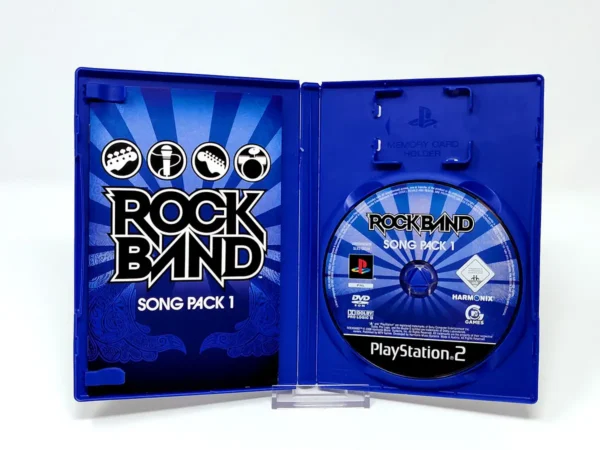 Interior del juego Rock Band: Song Pack 1 (FRA) para PlayStation 2 con disco y manual