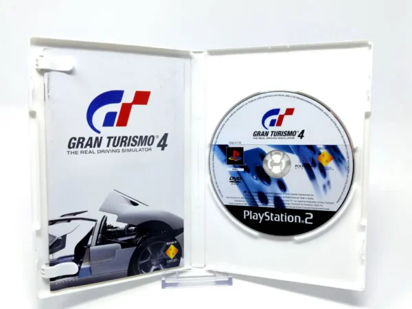 Interior del juego Gran Turismo 4 (ESP) para PlayStation 2 con disco y manual