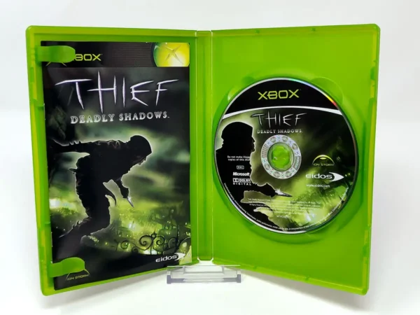 Interior del juego Thief: Deadly Shadows (ESP) para XBOX con disco y manual