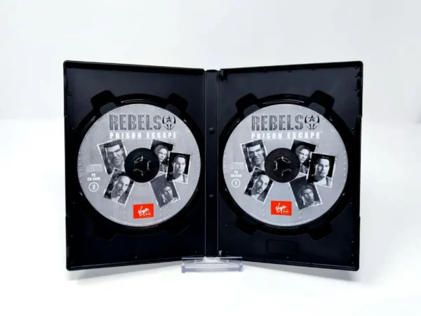Interior del juego Rebels: Prison Escape (ESP) para PC con disco y manual