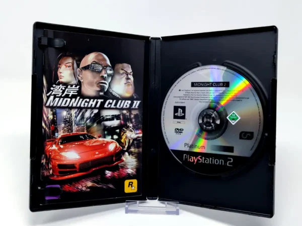 Interior del juego Midnight Club II (ESP) (Platinum) para PlayStation 2 con disco y manual