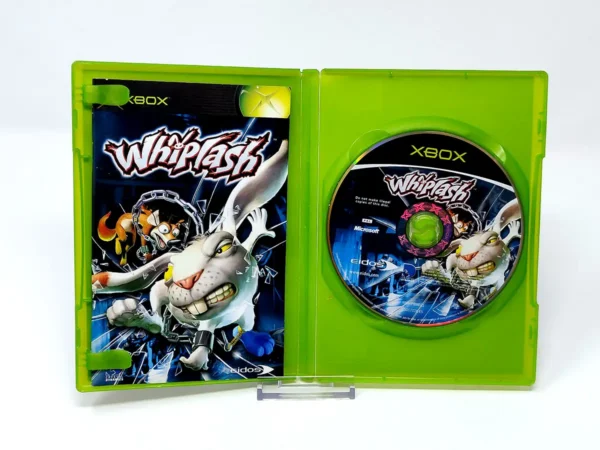 Interior del juego Whiplash (ESP) para XBOX con disco y manual