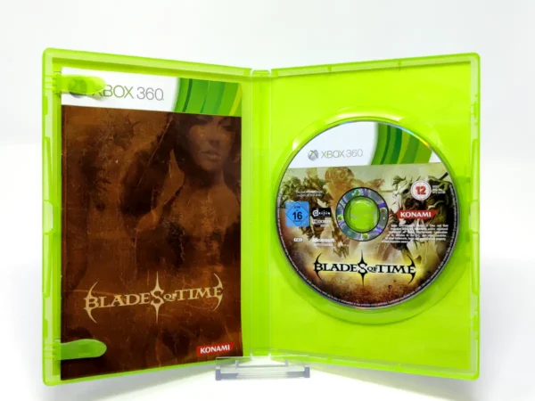 Interior del juego Blades of Time (ESP) para XBOX 360 con disco y manual