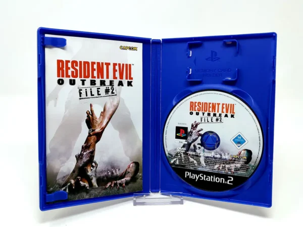 Interior del juego Resident Evil: Outbreak: File #2 (ESP) para PlayStation 2 con disco y manual