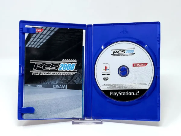Interior del juego PES 2008: Pro Evolution Soccer (ITA) para PlayStation 2 con disco y manual