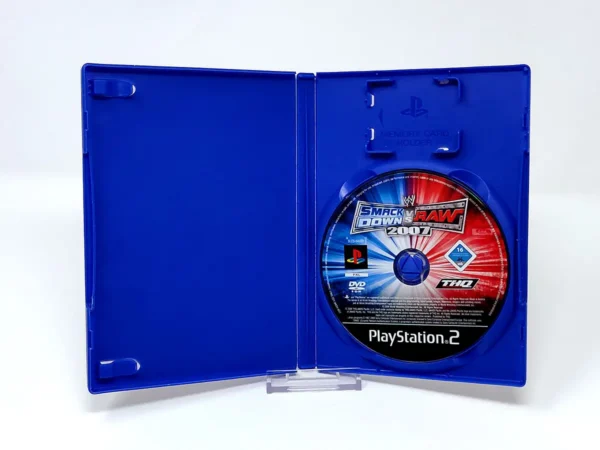 Interior del juego WWE SmackDown vs. Raw 2007 (FRA) (Rebajado) para PlayStation 2 con disco y manual