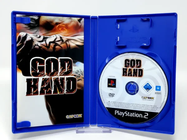Interior del juego God Hand (ESP) para PlayStation 2 con disco y manual