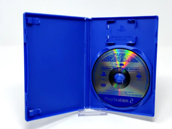 Interior del juego Syphon Filter: Dark Mirror (FRA) (Promo) para PlayStation 2 con disco y manual