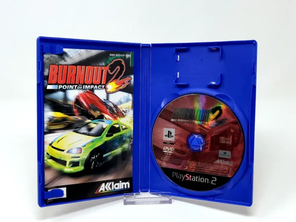 Interior del juego Burnout 2: Point of Impact (UK) para PlayStation 2 con disco y manual