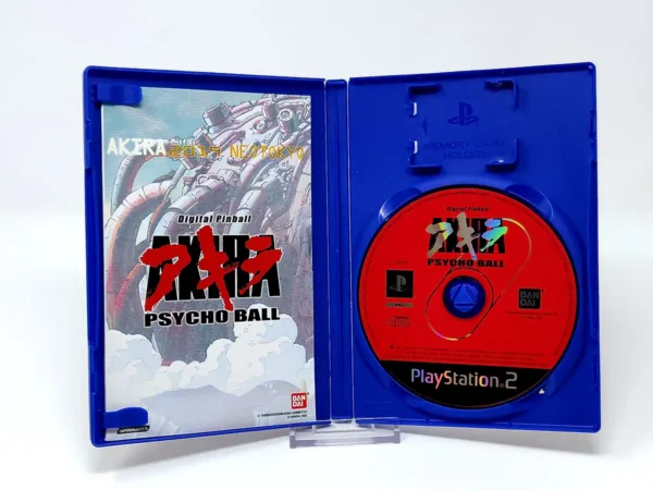 Interior del juego Akira Psycho Ball (FRA) para PlayStation 2 con disco y manual