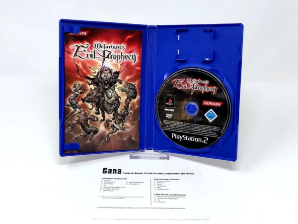 Interior del juego McFarlane's Evil Prophecy (ESP) para PlayStation 2 con disco y manual