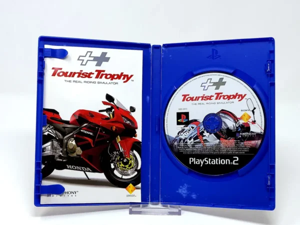 Interior del juego Tourist Trophy: The Real Riding Simulator (ITA) para PlayStation 2 con disco y manual