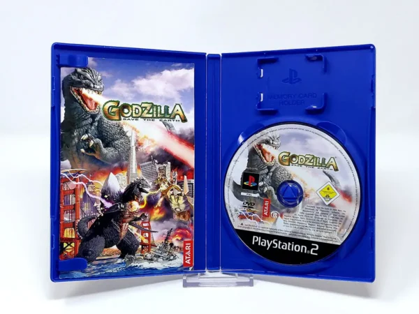 Interior del juego Godzilla: Save the Earth (FRA) para PlayStation 2 con disco y manual