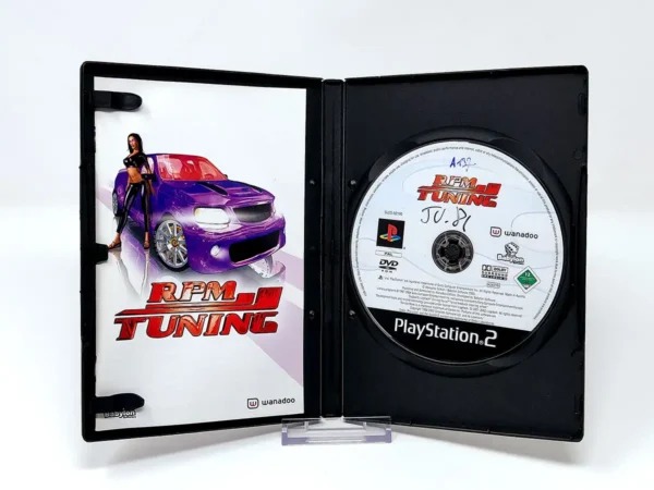Interior del juego RPM Tuning (FRA) para PlayStation 2 con disco y manual