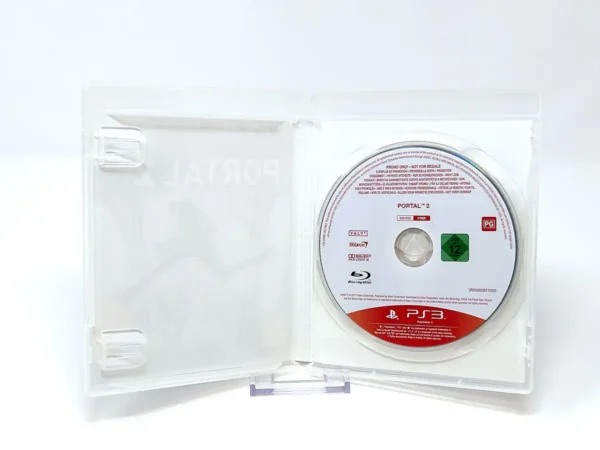 Interior del juego Portal 2 (ESP) (Promo) para PlayStation 3 con disco y manual