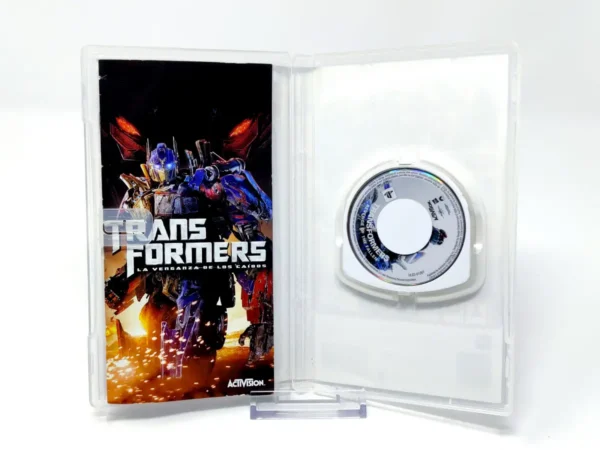 Interior del juego Transformers: La Venganza de los Caídos (ESP) (Essentials) para PSP con disco y manual
