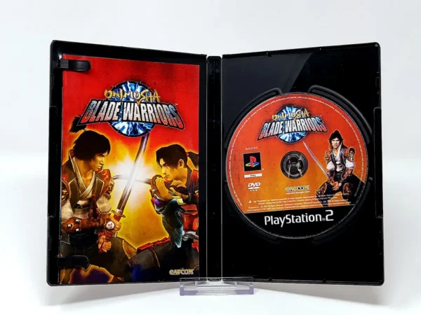 Interior del juego Onimusha: Blade Warriors (ESP) para PlayStation 2 con disco y manual