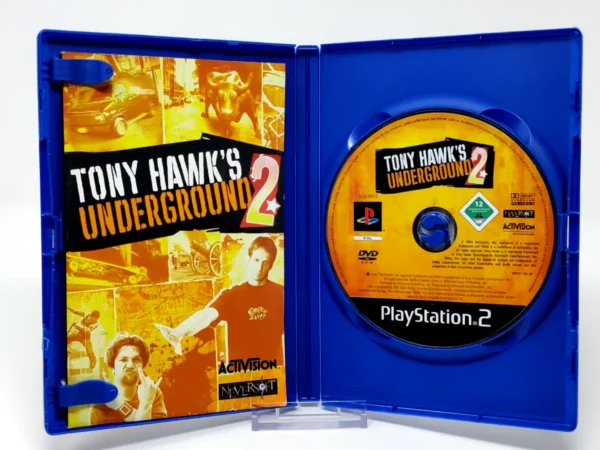 Interior del juego Tony Hawk's Underground 2 (ESP) para PlayStation 2 con disco y manual