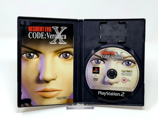 Interior del juego Resident Evil: Code - Veronica X (ESP) para PlayStation 2 con disco y manual