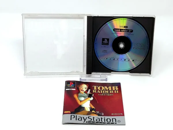 Interior del juego Tomb Raider II: Starring Lara Croft (ESP) (Platinum) para PlayStation 1 con disco y manual