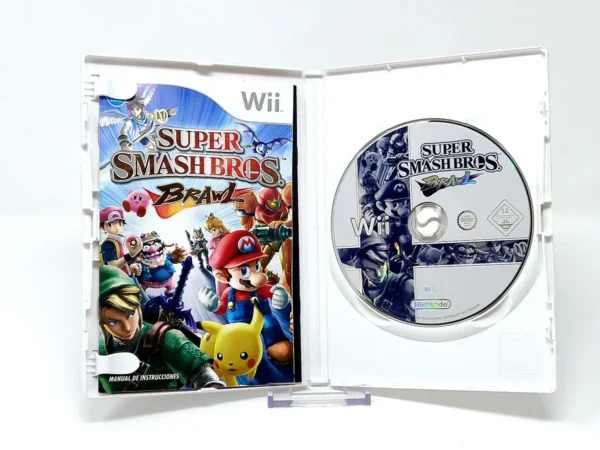 Interior del juego Super Smash Bros. Brawl (ESP) para Nintendo Wii con disco y manual