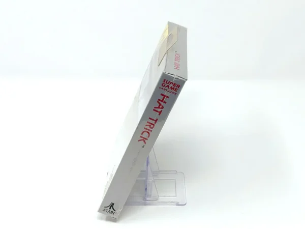 Interior del juego Hat Trick (Precintado) para Atari con disco y manual
