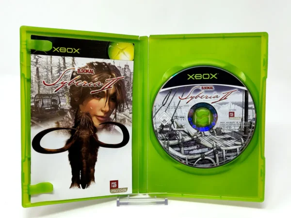 Interior del juego Syberia II (FRA) para XBOX con disco y manual