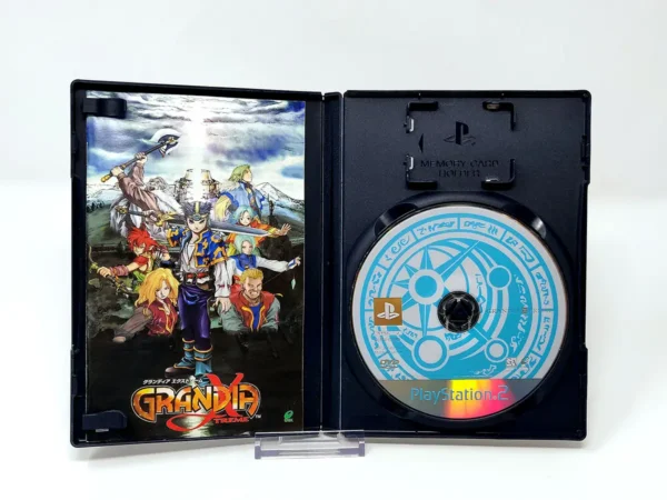 Interior del juego Grandia Xtreme (JAP) para PlayStation 2 con disco y manual