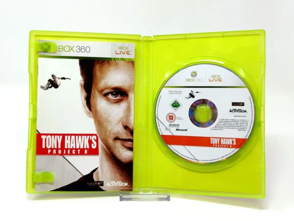 Interior del juego Tony Hawk's Project 8 (ESP) para XBOX 360 con disco y manual