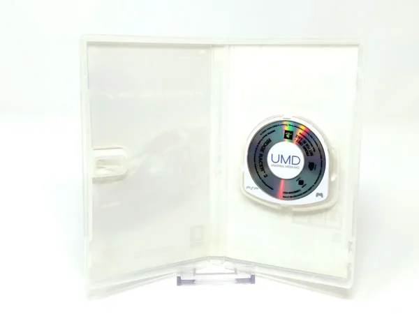 Interior del juego Ridge Racer 2 (ESP) (Promo) para PSP con disco y manual