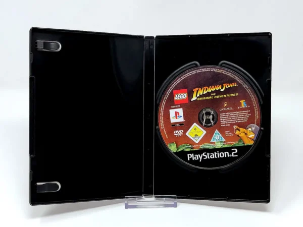 Interior del juego LEGO Indiana Jones: La Trilogía Original (ESP) (Rebajado) para PlayStation 2 con disco y manual