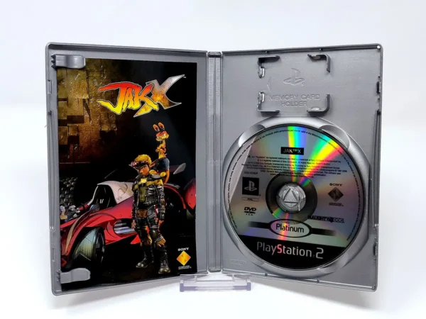 Interior del juego Jak X (FRA) (Platinum) para PlayStation 2 con disco y manual