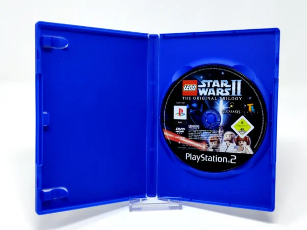 Interior del juego LEGO Star Wars II: La Trilogía Original (ESP) (Rebajado) para PlayStation 2 con disco y manual