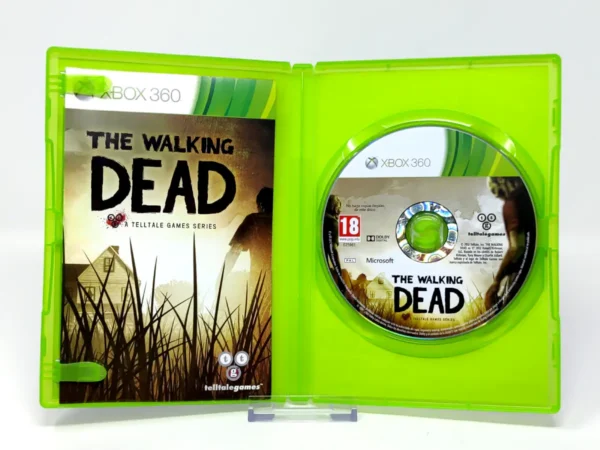 Interior del juego The Walking Dead: A Telltale Games Series (ESP) para XBOX 360 con disco y manual