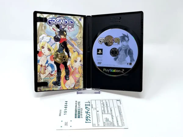 Interior del juego Grandia II (JAP) para PlayStation 2 con disco y manual