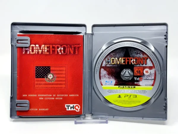 Interior del juego Homefront (Ultimate Edition) (UK) (Platinum) para PlayStation 3 con disco y manual