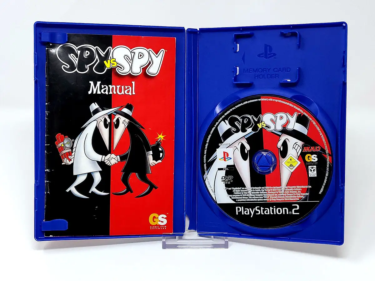 Interior del juego Spy vs. Spy (ESP) para PlayStation 2 con disco y manual