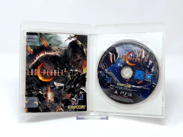 Interior del juego Lost Planet 2 (ESP) para PlayStation 3 con disco y manual