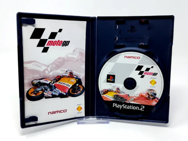Interior del juego MotoGP (ESP) para PlayStation 2 con disco y manual