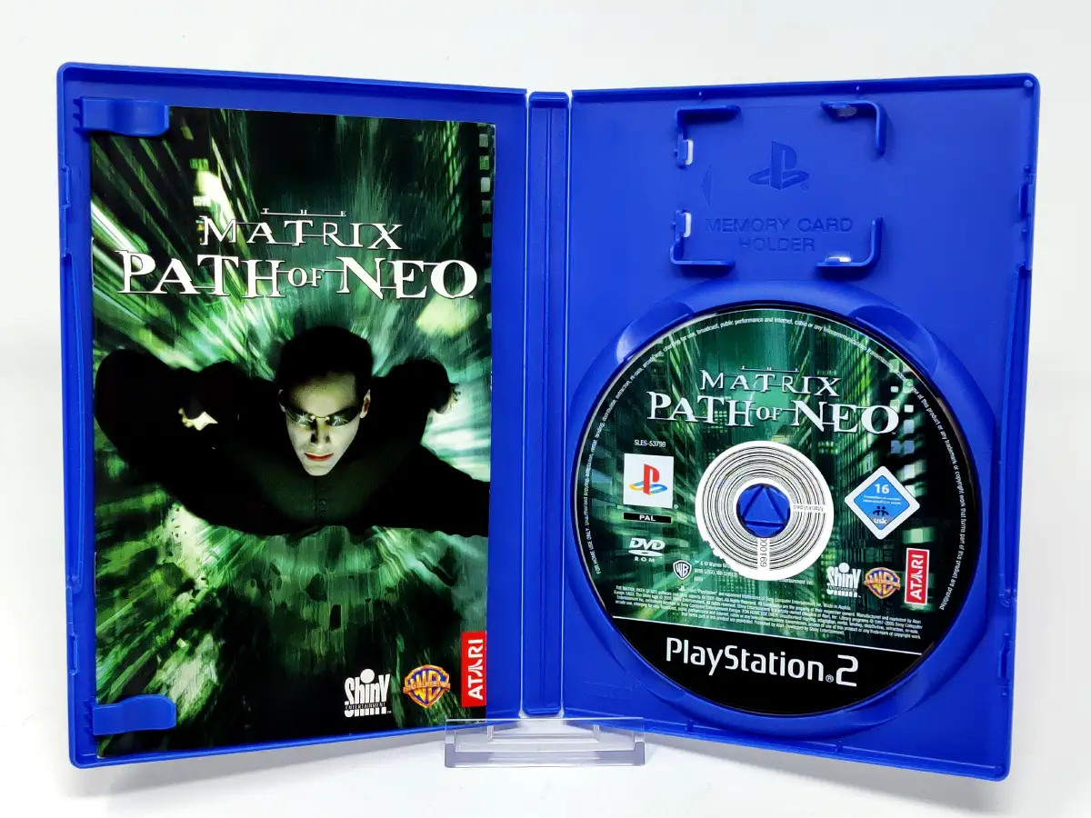 Interior del juego The Matrix: Path of Neo (FRA) (Rebajado) para PlayStation 2 con disco y manual