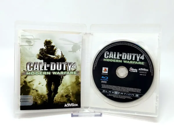 Interior del juego Call of Duty 4: Modern Warfare (ESP) para PlayStation 3 con disco y manual