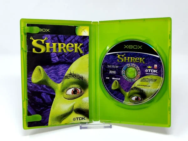Interior del juego Shrek (ESP) para XBOX con disco y manual