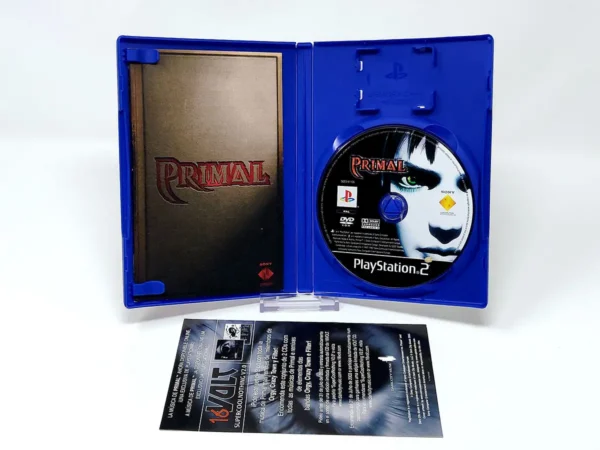 Interior del juego Primal (ESP) para PlayStation 2 con disco y manual