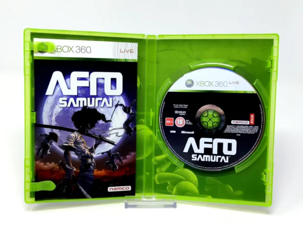 Interior del juego Afro Samurai (ESP) para XBOX 360 con disco y manual