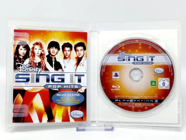 Interior del juego Disney Sing It: Pop Hits (ESP) para PlayStation 3 con disco y manual